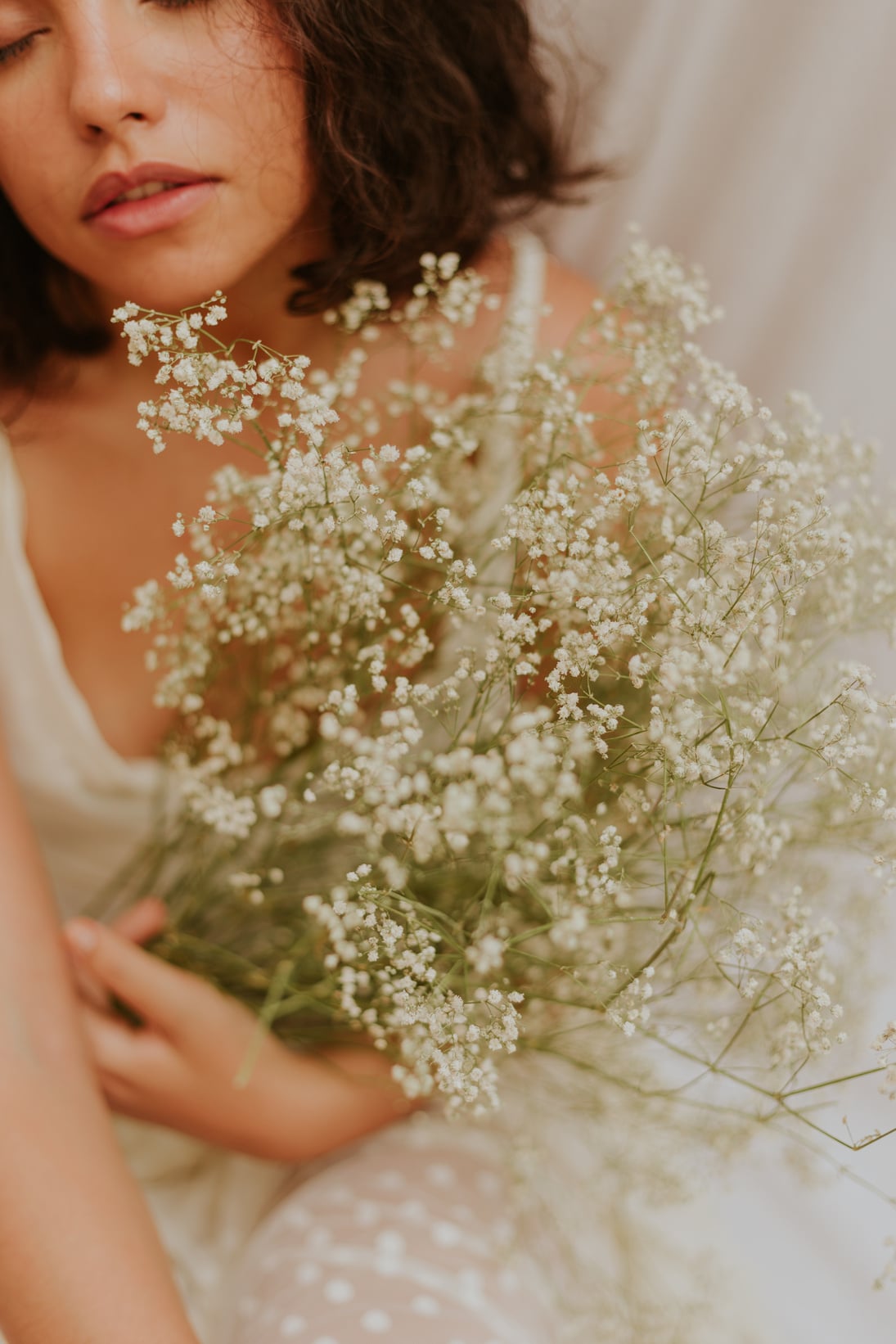 Woman holding White Flowers